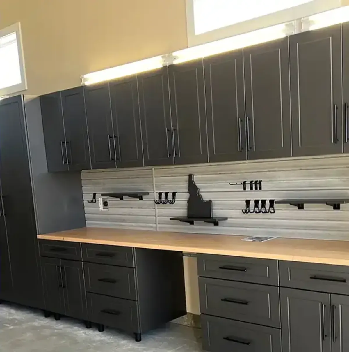 Powder-coated custom garage cabinets with workbench installed in a Treasure Valley Idaho garage